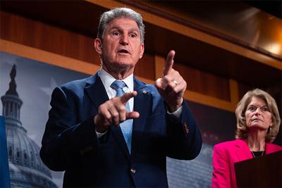 Senate Energy and Natural Resources Chair Joe Manchin (D-W.Va.) and Sen. Lisa Murkowski (R-Alaska), the panel's former chair, during a press conference yesterday on Russian energy imports.
