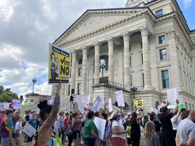 Abortion rights activists march around the state capitol in Topeka, Kan., calling for the defeat of the proposed constitutional amendment, July 30, 2022.
