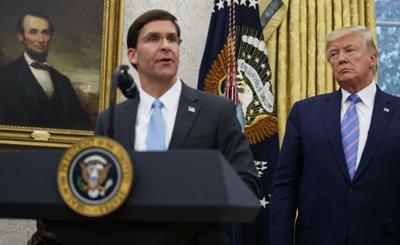President Donald Trump looks to Secretary of Defense Mark Esper during a ceremony in the Oval Office, July 23, 2019.