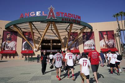 Fans enter Angel Stadium before a baseball game on April 7, 2022, in Anaheim, Calif.