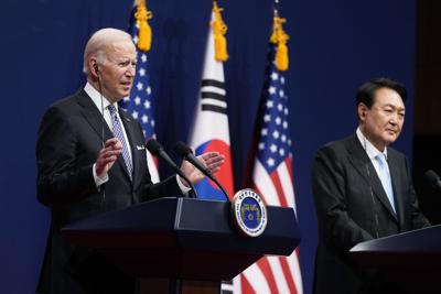 President Joe Biden, left, speaks as South Korean President Yoon Suk Yeol listens during a news conference at the People's House inside the Ministry of National Defense, Saturday, May 21, 2022, in Seoul, South Korea.