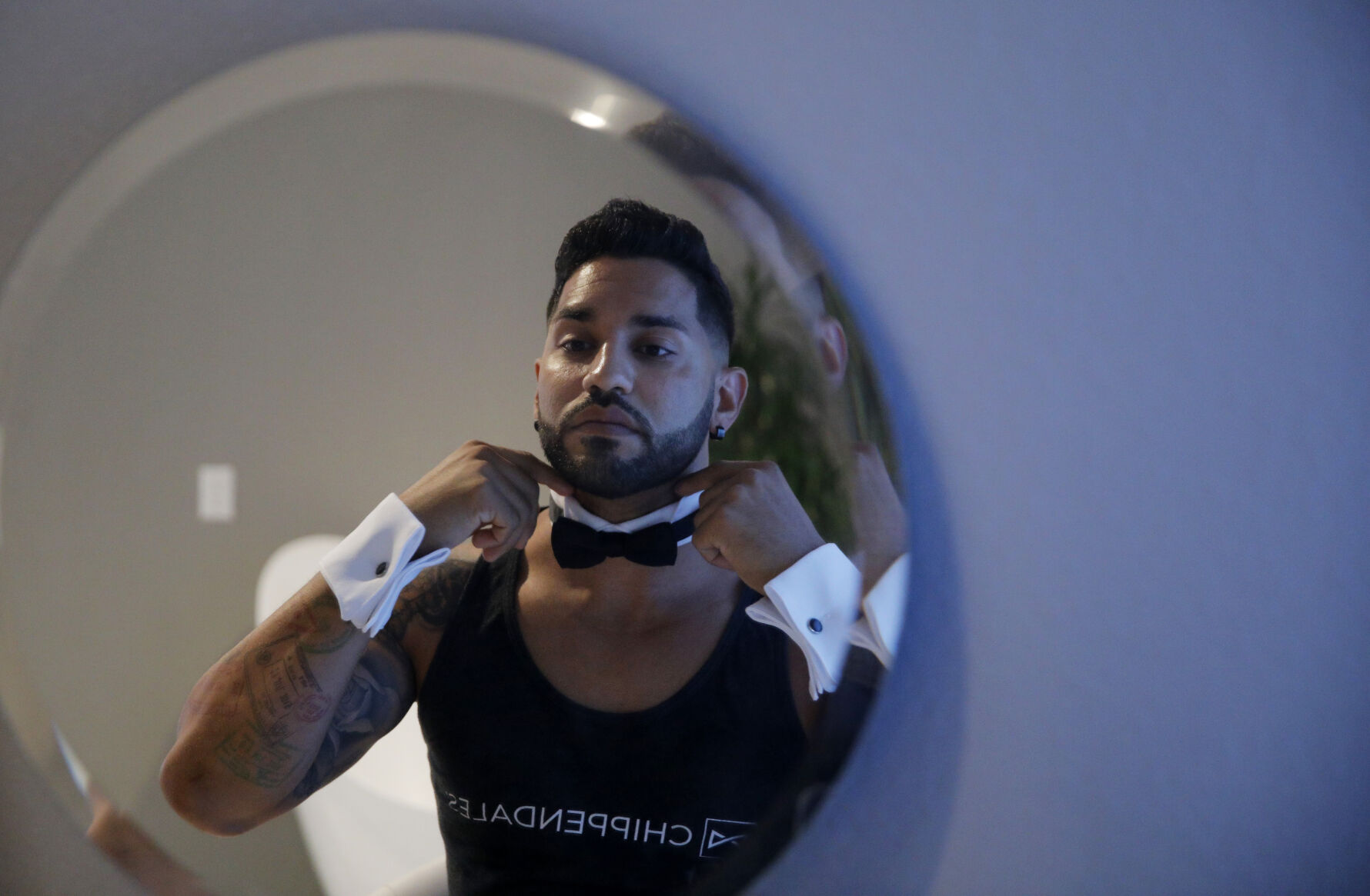 Chippendales dancer Miguel Rivera prepares for a virtual Zoom party from his home, June 19, 2020, in Las Vegas.