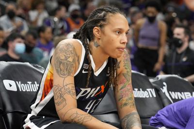 Phoenix Mercury center Brittney Griner sits during the first half of Game 2 of basketball's WNBA Finals against the Chicago Sky on Oct. 13, 2021, in Phoenix, Arizona.