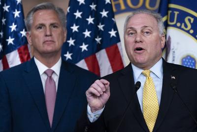 House Minority Leader Kevin McCarthy, left, listens as House Minority Whip Steve Scalise speaks during a news conference on Capitol Hill in Washington.