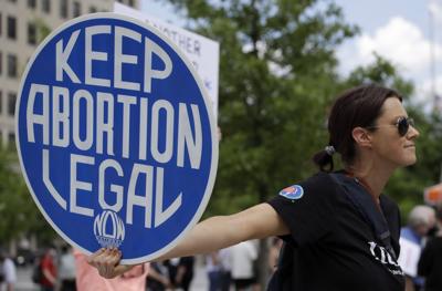 An abortion-rights demonstrator holds a sign during a rally on Saturday in Chattanooga, Tenn.