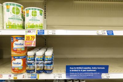 Baby formula is displayed on the shelves of a grocery store with a sign limiting purchases in Indianapolis, Tuesday, May 10, 2022.