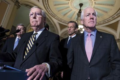 Senate Minority Leader Mitch McConnell, left, has praised the bipartisan gun safety legislation that Sen. John Cornyn and three other senators formed as one that “would make our country safer without making it less free.”