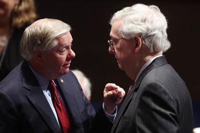 Sen. Lindsey Graham, left, speaks with Senate Minority Leader Mitch McConnell at the Capitol.