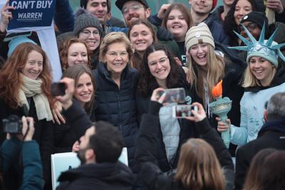 Then-Democratic presidential candidate Elizabeth Warren (D-Mass.) visits with supporters on Feb. 11, 2020, in Durham, N.H. New Hampshire's lack of racial diversity is a serious potential stumbling block in its bid to become first in Democrats' president...