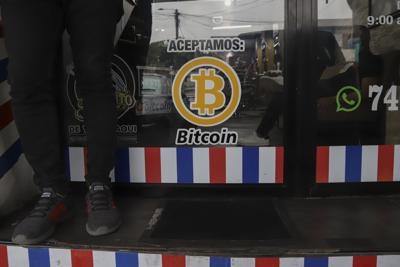 "We accept Bitcoin" is announced at a barber shop in Santa Tecla, El Salvador, Sept. 4, 2021.