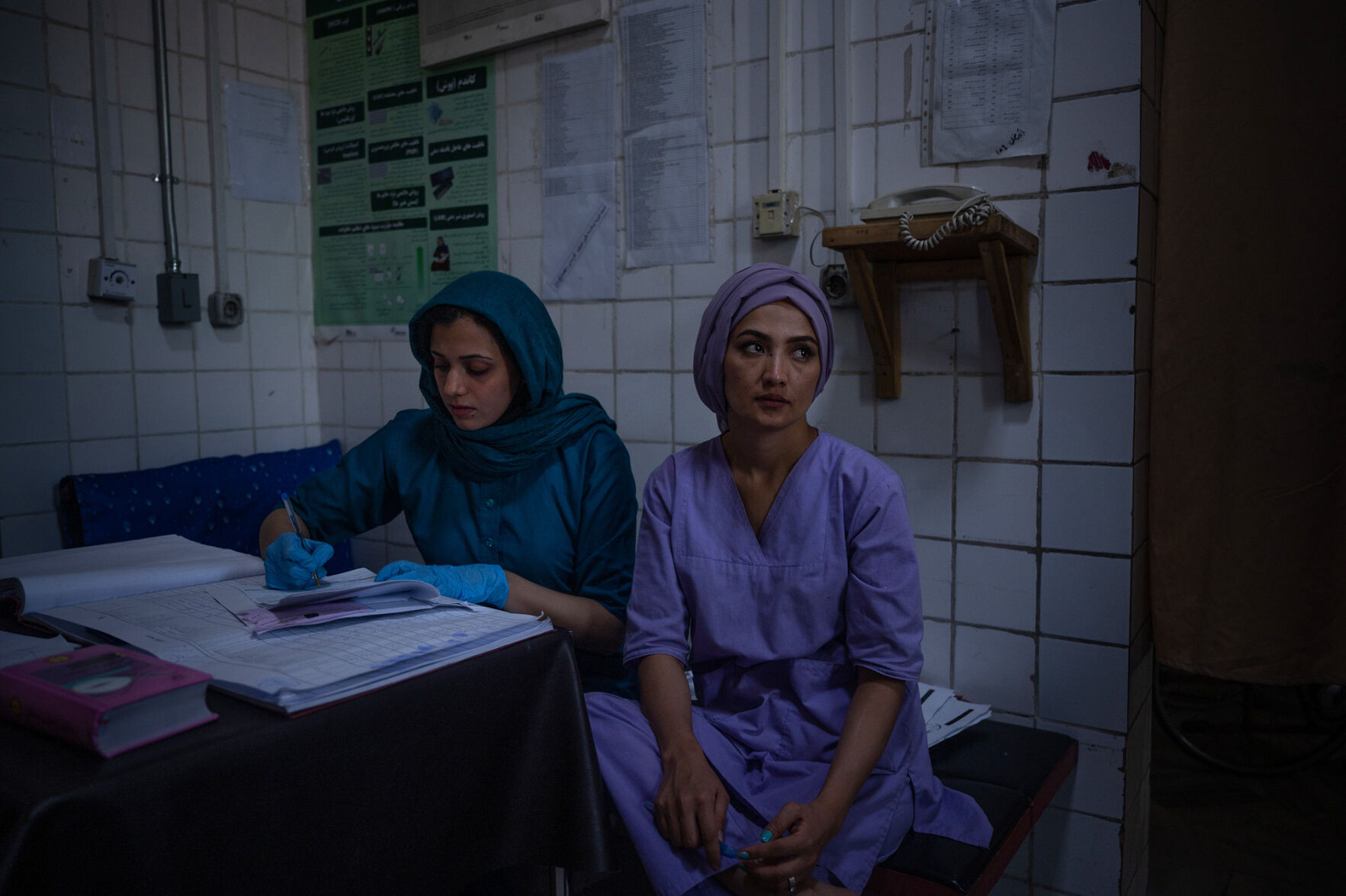 A doctor and a midwife update patient records at a busy maternity hospital in Kabul, Afghanistan, August 8.