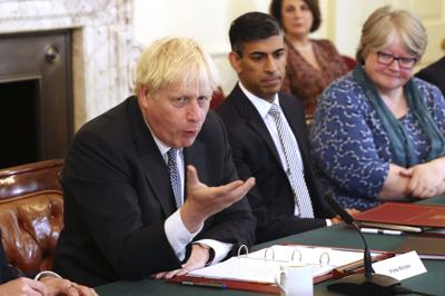 Britain's Prime Minister Boris Johnson, left, and Britain's Chancellor of the Exchequer Rishi Sunak, center, take part in a cabinet meeting, in Downing Street, London, Tuesday, July 5, 2022. (Ian Vogler/Pool Photo via AP)