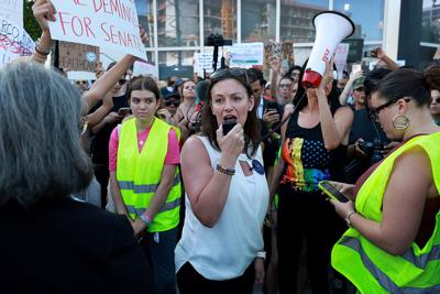 Florida Agriculture Commissioner Nikki Fried joins with people to protest the Supreme Court's decision in the Dobbs v. Jackson Women's Health case on June 24, 2022, in Miami.