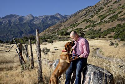 Utah Senate candidate Evan McMullin with his dog, Moose, near his home in Highland, Utah, on July 5.