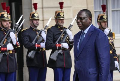 President Macky Sall of Senegal reviews the honour guards as he arrived at the Elysee Palace to meet  President Emmanuel Macron on June 10, 2022.