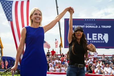 Rep. Mary Miller (R-Ill.), left, is joined by Rep. Lauren Boebert (R-Colo.) on stage at a rally at the Adams County Fairgrounds in Mendon, Ill., Saturday, June 25, 2022.