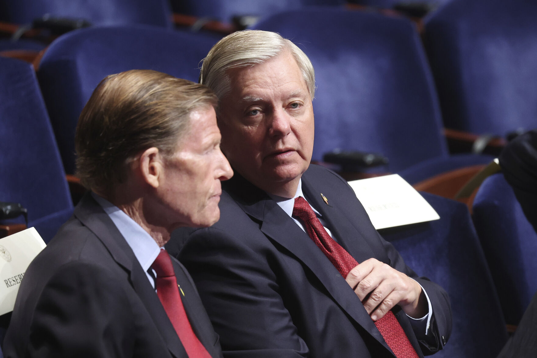 Sen. Richard Blumenthal talks with Sen. Lindsey Graham.