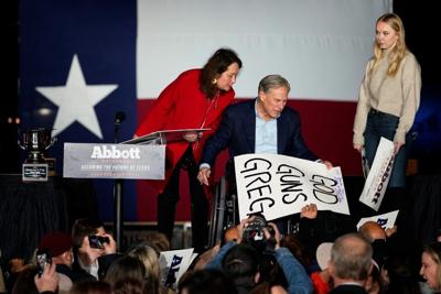 Texas Gov. Greg Abbott, with his wife Cecilia and daughter Audrey, attends a primary election night event on Tuesday in Corpus Christi.