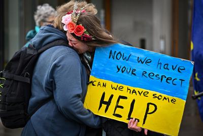 Ukrainians rally against Russia's invasion outside the Scottish Parliament .