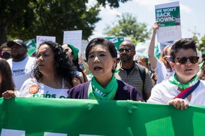 Rep. Judy Chu (D-Calif.) marches with abortion-rights advocates near the U.S. Supreme Court.