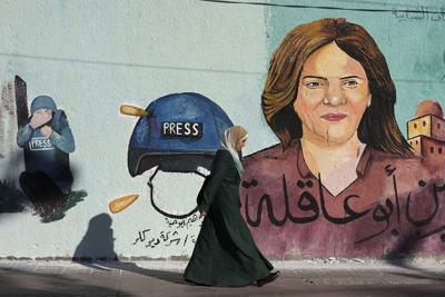 A mural of slain of Al Jazeera journalist Shireen Abu Akleh adorns a wall, in Gaza City on May 15, 2022.