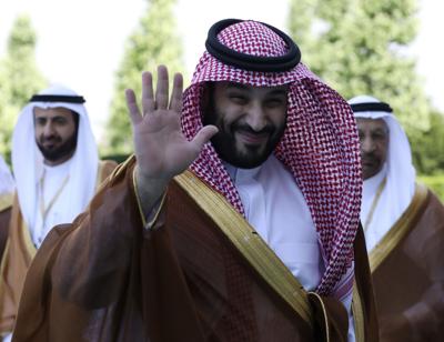 Saudi Crown Prince Mohammed bin Salman greets the media members during a welcome ceremony, in Ankara, Turkey, Wednesday, June 22, 2022.