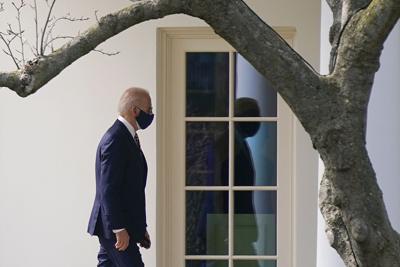 President Joe Biden walks to the Oval Office of the White House in Washington.