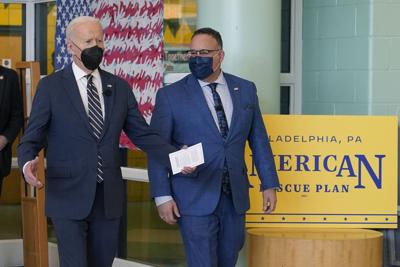 President Joe Biden arrives with Education Secretary Miguel Cardona to visit with students at Luis Muñoz Marin Elementary School in Philadelphia, Friday, March 11, 2022.