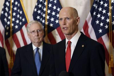 Rick Scott and Mitch McConnell speak to reporters.