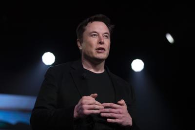 Tesla CEO Elon Musk speaks before unveiling the Model Y at the company's design studio in Hawthorne, Calif., on March 14, 2019.