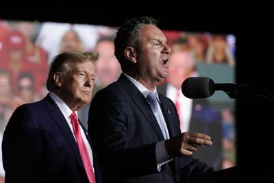 Wisconsin Republican gubernatorial candidate Tim Michels, right, speaks as former President Donald Trump, left, listens at a rally Friday, Aug. 5, 2022, in Waukesha, Wis.