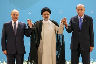 Russian President Vladimir Putin, left, Iranian President Ebrahim Raisi, center, and Turkish President Recep Tayyip Erdogan pose for a photo prior to their talks at the Saadabad palace, in Tehran, Iran, Tuesday, July 19, 2022.