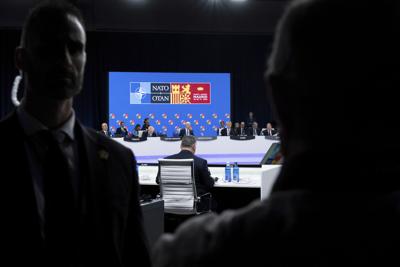 Turkish Foreign Minister Mevlut Cavusoglu, British Prime Minister Boris Johnson, President Joe Biden, and NATO Secretary-General Jens Stoltenberg are seated before attending a round table meeting at a NATO summit in Madrid, Spain on Wednesday, June 29, ...