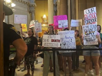 Abortion-rights protesters fill Indiana Statehouse corridors and cheer outside legislative chambers, on Friday, Aug. 5, 2022, as lawmakers vote to concur on a near-total abortion ban, in Indianapolis.