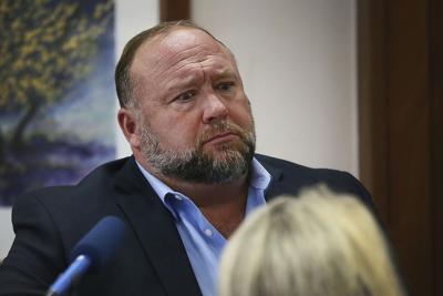 Conspiracy theorist Alex Jones attempts to answer questions about his emails during trial at the Travis County Courthouse in Austin, on Aug. 3, 2022.