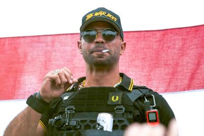 Proud Boys leader Henry "Enrique" Tarrio wears a hat that says The War Boys during a rally in Portland, Ore. on Sept. 26, 2020.