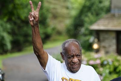 This June 30, 2021, file photo shows Bill Cosby gesturing outside his home in Elkins Park, Pa., after being released from prison.