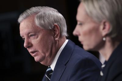 U.S. Sen. Lindsey Graham (R-S.C.) and Ukrainian-American Rep. Victoria Spartz (R-Ind.) speak to reporters on Russia's invasion of Ukraine at the U.S. Capitol on Wednesday.