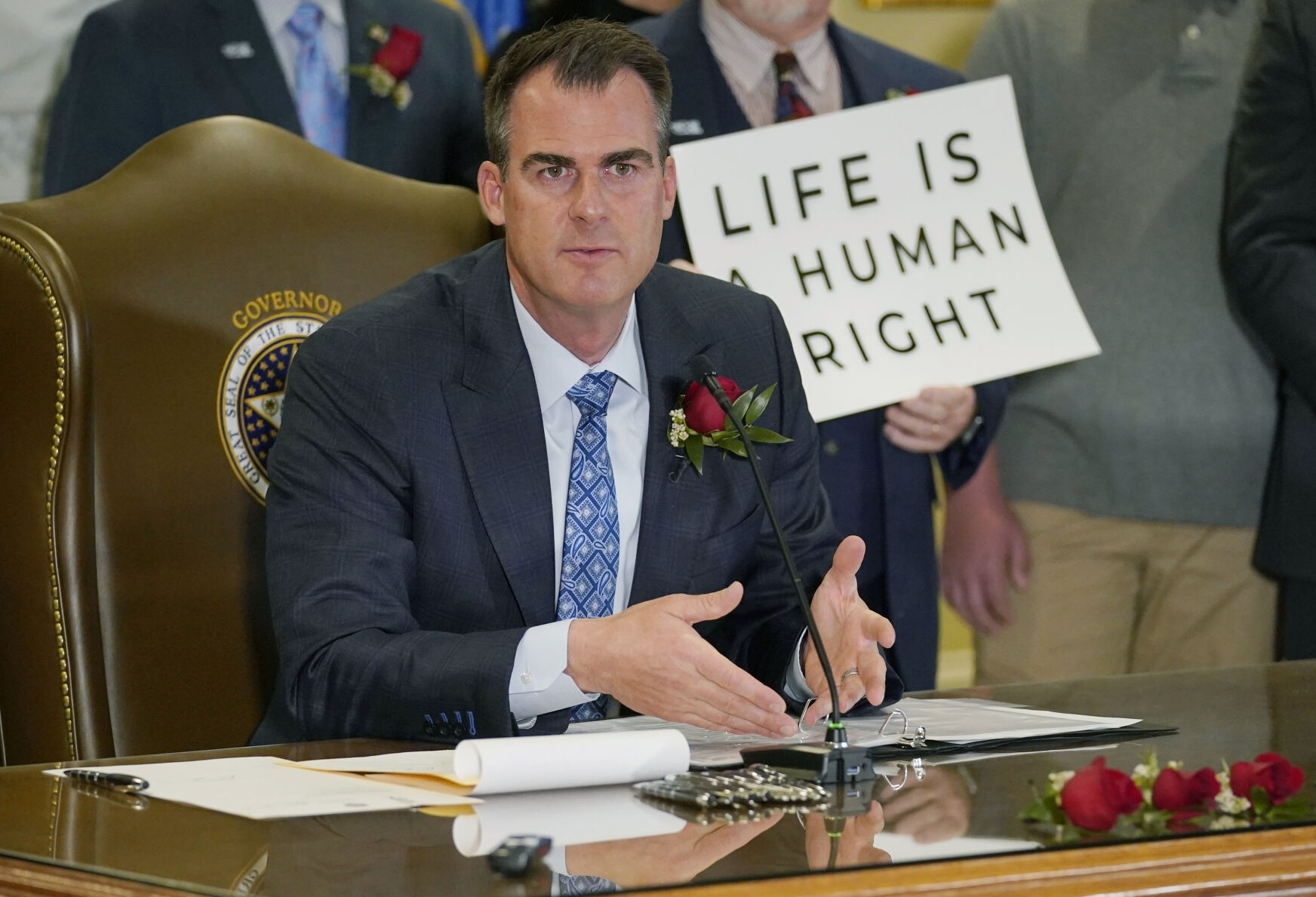 Oklahoma Gov. Kevin Stitt speaks after signing into law a bill making it a felony to perform an abortion, punishable by up to 10 years in prison, on April 12, 2022, in Oklahoma City.