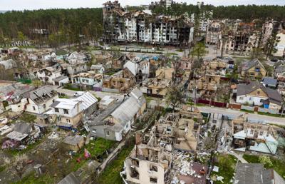 Destroyed houses are photographed in Irpin, on the outskirts of Kyiv, Ukraine, on April 30, 2022. An undetermined number of Americans are thought to be in the country battling Russian forces beside both Ukrainians and volunteers from other countries.