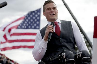 Rep. Madison Cawthorn (R-N.C.) speaks to the crowd before former President Donald Trump takes the stage at a rally Saturday, April 9, 2022, in Selma, N.C.