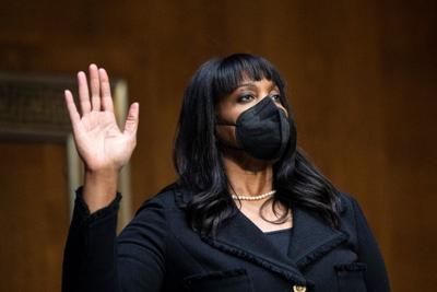 Lisa Cook is sworn in during a Senate Banking, Housing and Urban Affairs Committee confirmation hearing on Thursday, Feb. 3, 2022, in Washington.