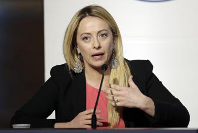 FILE - Brothers of Italy's Giorgia Meloni attends a media event for center-right leaders in Rome, on March 1, 2018. Italy's fascist legacy faces increasingly scrutiny these days, with elections for Parliament on Sept 25, 2022. Opinion polls indicate the...