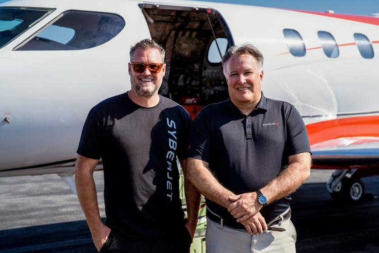 SyberJet CEO Trevor Milton (left) and pilot Gordon “Gordy” Bryan (right) in front of the record-setting SJ30-2 following the transcontinental flight.
