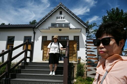 A woman poses for photos at the Woljeong-ri Station in Cheorwon, Gangwon Province in South Korea