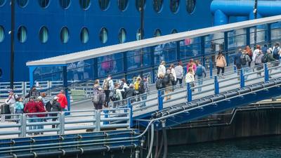 cruise passengers boarding ship - 1