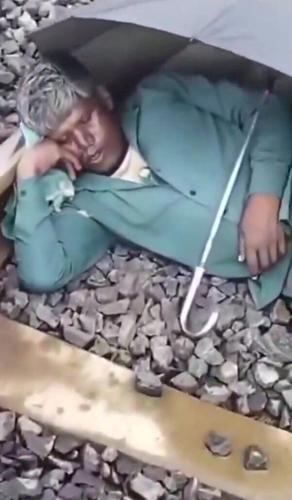 A train driver was forced to slammed on the brakes after a man was found fast asleep – on the tracks