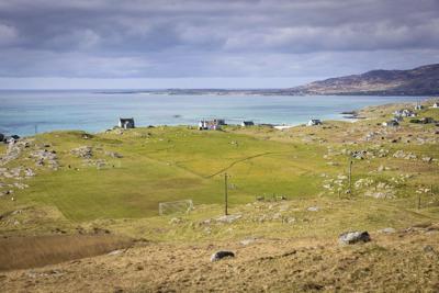 Eriskay football pitch is known for its bumpy surface and breath-taking views and was recognised by Fifa as one of the eight most remarkable places to play football in the world. © VisitScotland / Kenny Lam