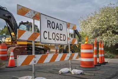 road closed - sign and barrier on a residential street for construction