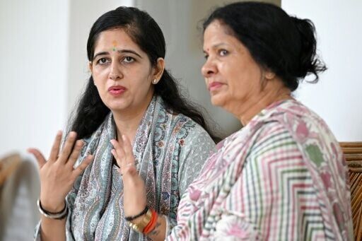 Ritu Pant (L), wife of Indian merchant navy captain Ajay Pant, speaks to AFP next to her mother-in-law Deepa Pant at Ramnagar in India's Uttarakhand state